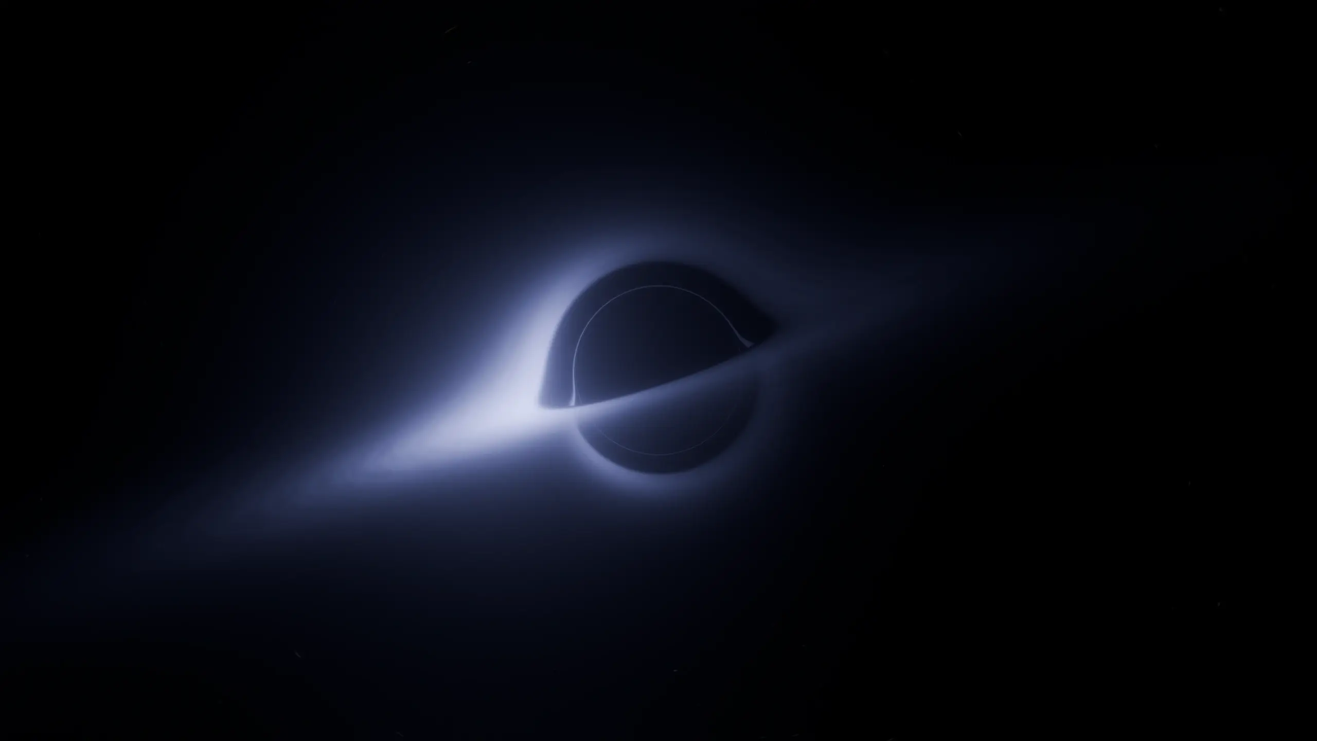 A rendered black hole: its accretion disc lensed into a bright ring that arcs above and below the event horizon.